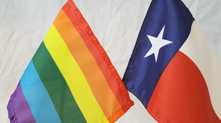 The LGBT+ flag and the Texas state flag side by side